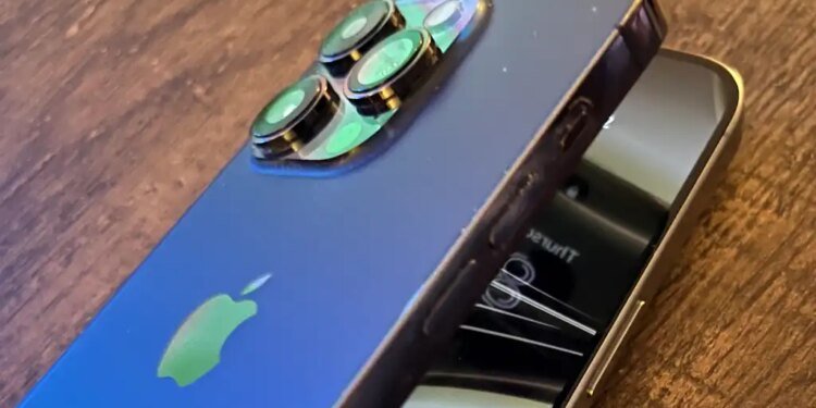 An image with two iPhones made to look like they're folding