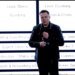 Elon Musk stands in front of xAI's new org chart