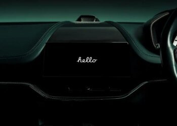 Aston Martin dashboard with Apple CarPlay Ultra saying hello