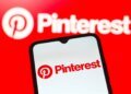 In this photo illustration, the Pinterest logo is seen displayed on a smartphone screen.