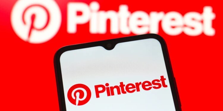 In this photo illustration, the Pinterest logo is seen displayed on a smartphone screen.