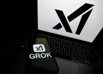 The Grok logo appears on a phone and the xAI logo is displayed on a laptop.