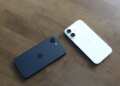 Two Apple iPhone 16e units splayed on table
