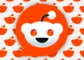 large Reddit logo overlaying background of smaller logo silhouettes