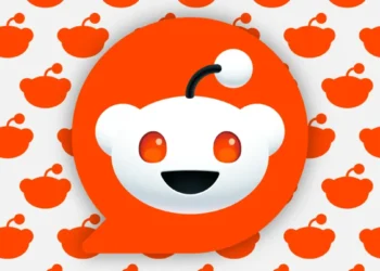 large Reddit logo overlaying background of smaller logo silhouettes