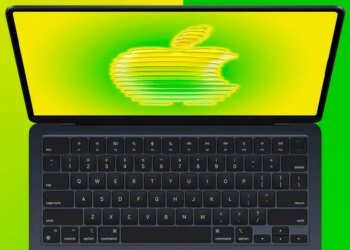 MacBook Air open with a stylized Apple logo on the screen