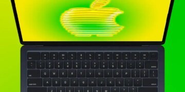 MacBook Air open with a stylized Apple logo on the screen