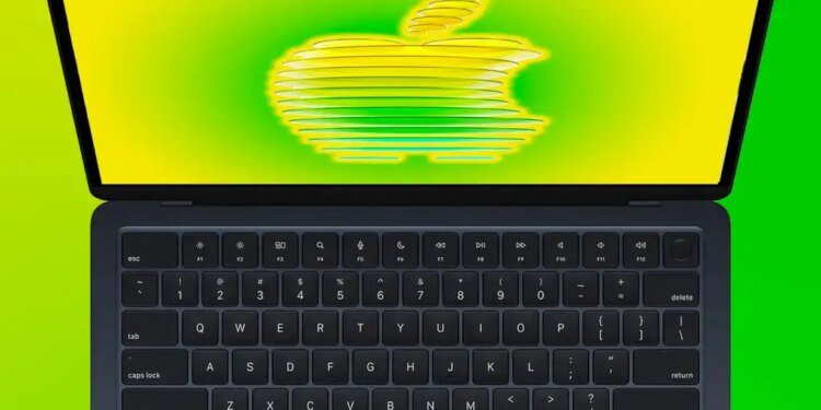 MacBook Air open with a stylized Apple logo on the screen