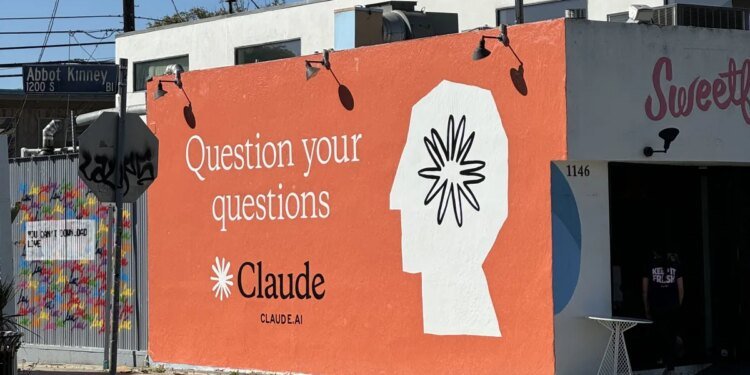 Claude ad on side of building