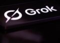 The Grok logo is displayed on a mobile phone screen