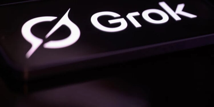 The Grok logo is displayed on a mobile phone screen