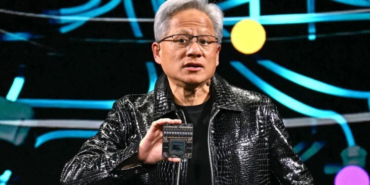 Jensen Huang holds up chip at CES 2025