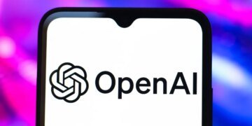 The OpenAI logo is seen displayed on a smartphone screen.