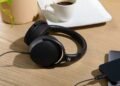 Photo of HD 400U headphones on table beside iPhone