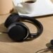 Photo of HD 400U headphones on table beside iPhone